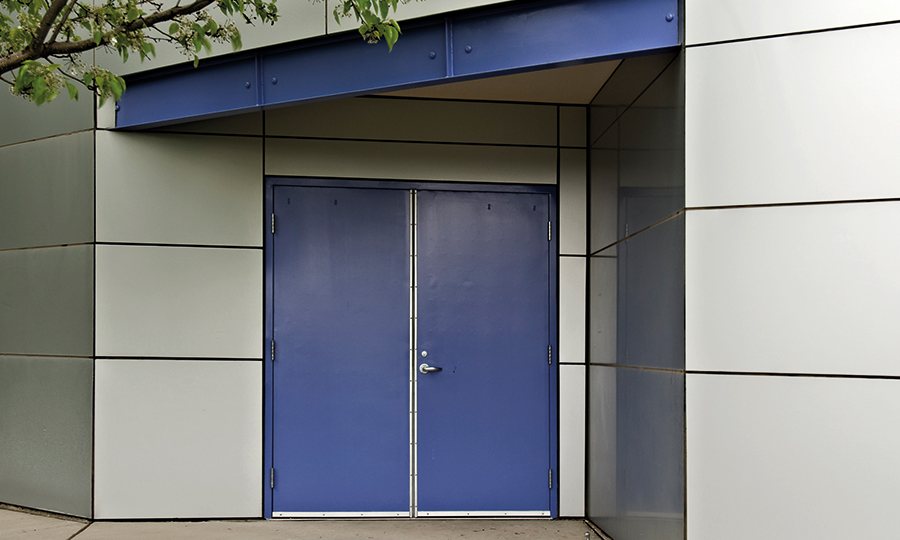 Double fire exit doors with compliant ironmongery